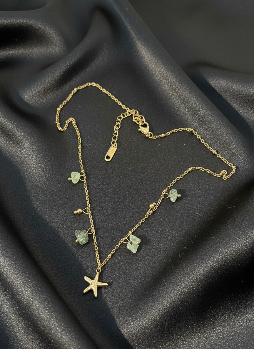 Starfish charm necklace with green gems