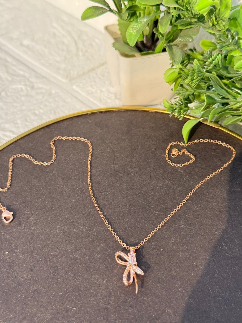 Rose gold bow pendant necklace
